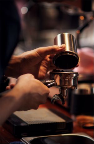 Image of a woman with a cup of coffee